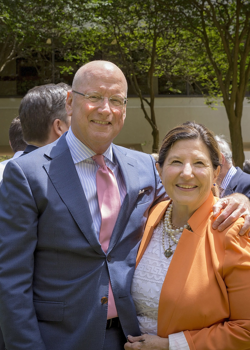 President William Henrich and his wife, Mary, smiling at an outdoor event.